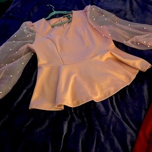 Puff sleeve blouse with pearls and Maroon suede leggings.